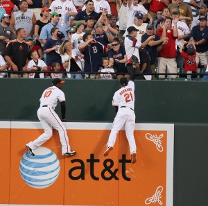Adam Jones (L) and Nick Markakis (R) demonstrate why they deserve a Gold Glove.