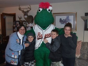 Louie, the Bowie Baysox Mascot poses with family