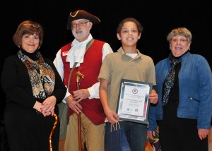 Squire Richard Hillman of Annapolis Tours by Watermark presents African American Heritage Award to Cameron Terrelonge, a student at Magothy River Middle School. (Courtesy Photo)