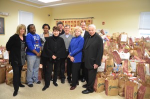 L to R Pam Siemer, Development Director, Light House Marcus Grant, Kitchen and Pantry Manager, Light House Michele Marshall, Associate Development Director, Light House Kitty and John Van de Kamp, she is Pres. of the St Vincent de Paul Society conference (John is her husband), Sam Davies, Volunteer Coordinator for the Food Drive, Elaine Larison, St. Mary’s Food Drive Coodinator, Deacon Leroy Moore and Father Kevin Milton.  
