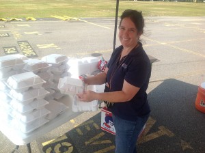 Lisa Lima of the Annapolis Salvation Army prepares boxed lunches at the POD site.