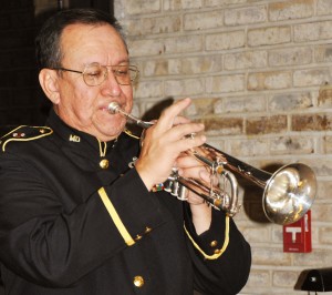 A bugler sounds taps at a past Veterans’ Day Ceremony.