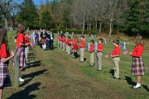 The fourth and fifth grade students in the flag line for the bagpipe procession at Rockbridge Academy's Veterans Day Ceremony