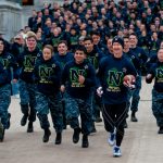 And they’re off…Midshipmen running with Army-Navy game ball