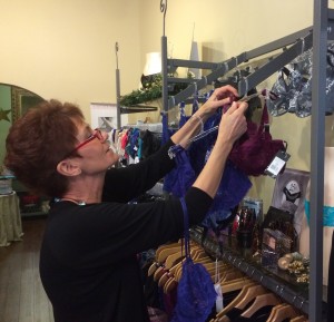 Valerie Wagner, a certified bra fitter at á la mode intimates, checks store stock for sizes. This month, á la mode intimates in the Annapolis Towne Center is offering $5 off a new bra when you turn in a worn or ill-fitting bra. 