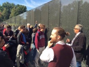 Vietnam Veterans Memorial Fund founder Jan Scruggs, right, talks about “The Wall” while Annapolis High School’s Performing and Visual Arts film students listen in. Their teacher, Leo P. Hylan III, is pictured in the foreground. Photo by Jimmy Wilburn for Hospice of the Chesapeake.