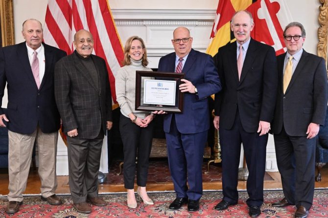 HA President and CEO Karen Brown presents a 2022 Preservation Award to Governor Larry Hogan, with Jeff Brown of Lewis Contractors, HA Trustees Carroll Hynson and Jim Reid, and HA Senior Vice President Michael Day. Photo courtesy of the Governor's office.